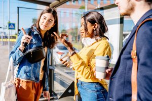 woman asking another woman for directions