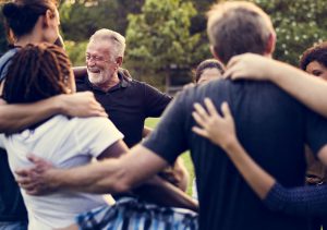 family multigenerational hugging