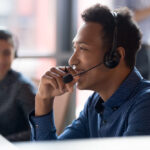 Smiling,Young,African,Businessman,Call,Center,Agent,Wear,Wireless,Headset