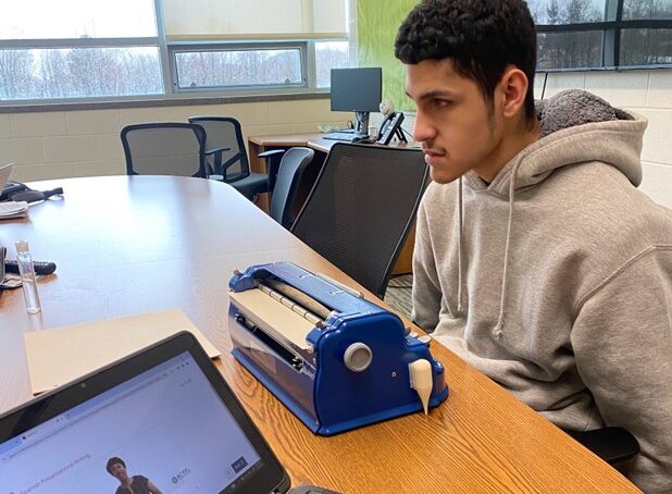 Jose taking the AAPPL on his Braille machine