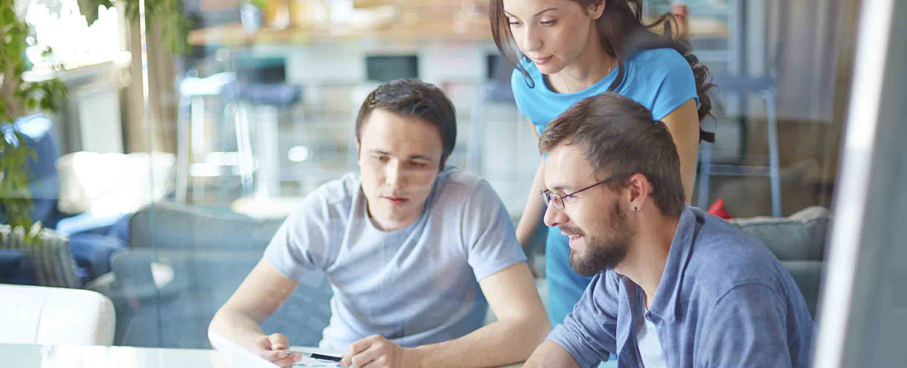 2 men and 1 woman looking off screen